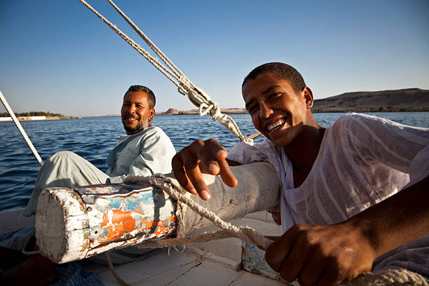 Felucca Sailors on Arabic Felucca. Asuwan felucca boat stock pictures, royalty-free photos & images