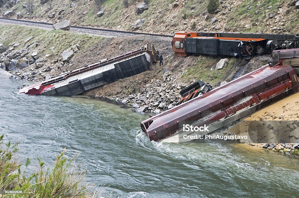 Train derailment caused by landslide in Wyoming Diesel fuel spilling into river after train derailment caused by landslide in Wyoming Train Crash Stock Photo