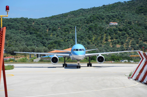 An aircraft manoeuvring after landing at  Skiathos Airport on the Aegean Greek island.