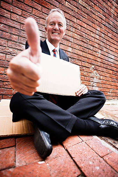istock Begging businessman seems happy with his situation 182805616