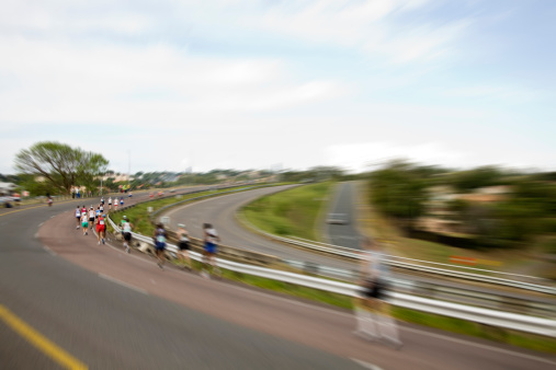 A concept image of ultra marathon runners with focus zoom on runners.Here are similar images.