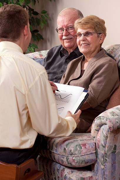 istock Financial Advisor making plans with Senior Couple 182806087