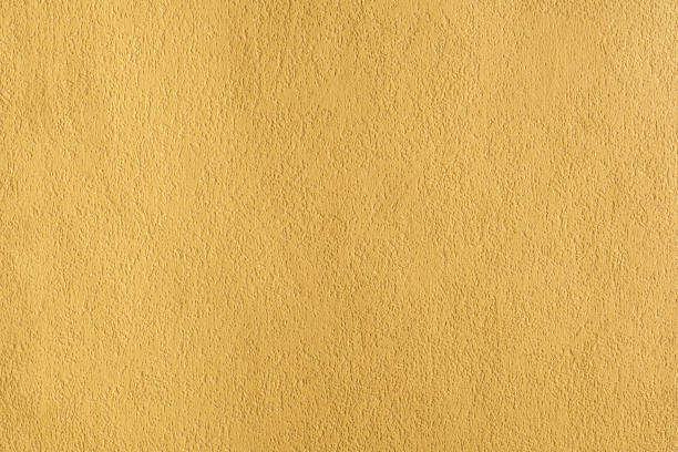 istock yellow stucco concrete texture wall background detail design backdrop 1828061118