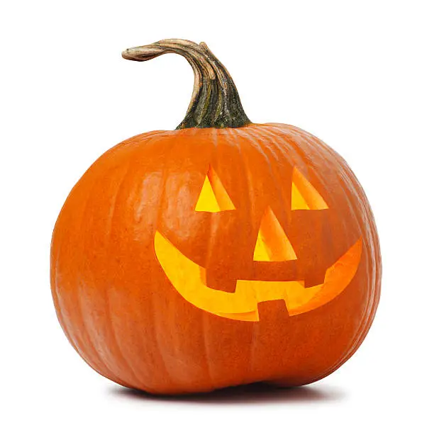 A jack O' Lantern on white. Clipping path included.  The jack O' Lantern glows with a warm light and the wistful curve of the stem makes this pumpkin the ideal jack O' Lantern.  It stands ready to for Halloween and the tradition of Trick-Or-Treat.  The jack O' Lantern is carved with the traditional eyes, nose, and smile. 