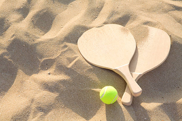 istock Sandy background with wonderfully contrasting beach racquet 182807027