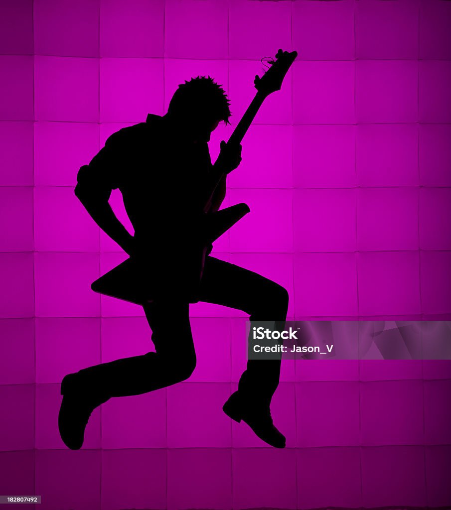 Chitarrista saltare Silhouette - Foto stock royalty-free di Chitarra