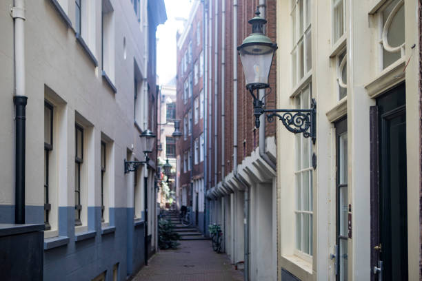 istock Alley between old city buildings 1828077845