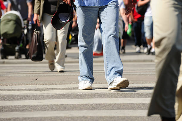 istock Summer dressed pedestrians crossing street 182807987