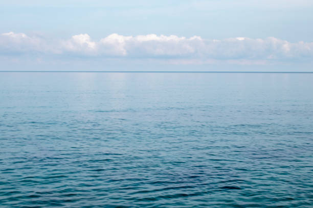 istock Blue ocean panorama, expansive scene with clear sky, ripple wave and calm sea with beautiful sunshine 1828082147