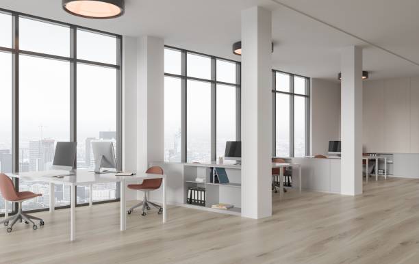 istock Cozy business interior with pc monitors and drawer with panoramic window 1828083762