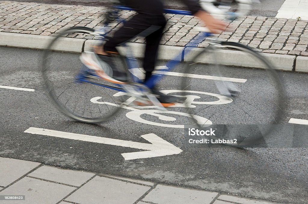 Motion blurred roadbike A cyclist going to work in the bicycle lane Bicycle Stock Photo