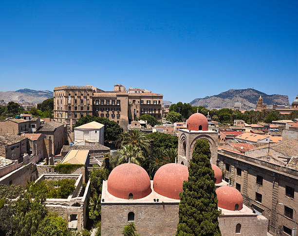 Palermo cityscape with 12th-century church San Giovanni degli Eremeti (St. John of the Hermits) in the front.See also: