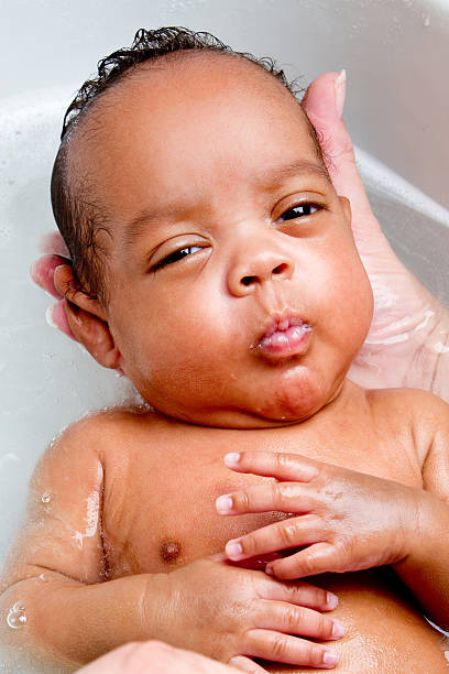istock Cute Baby Boy Bathing in Kitchen Sink 182808493