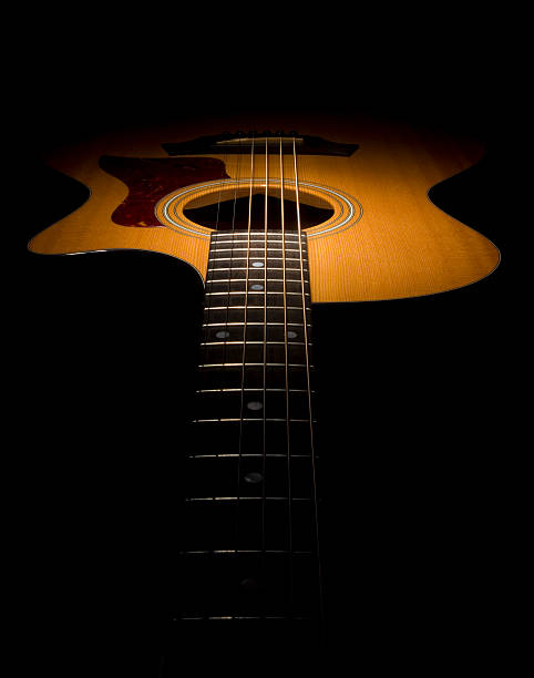 istock Guitar in shadow with acoustic guitar 182809046
