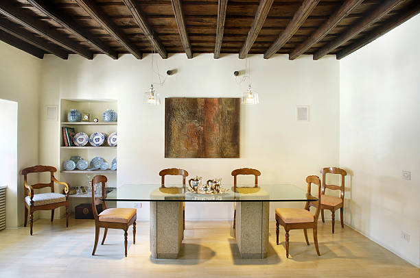istock Rustic, precious dining room, glass table, wooden chairs, porcelaine 182809314