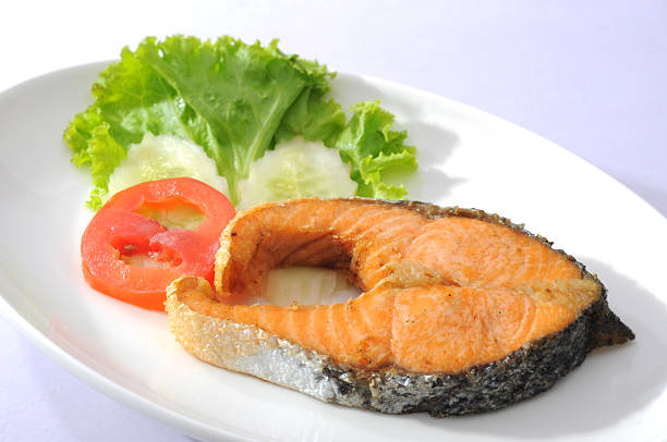 istock Salmon Fillet with vegetable isolated on white 182809444