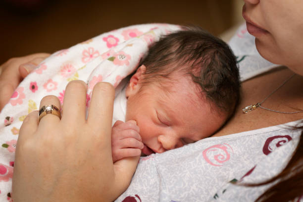 Newborn Preemie with Mother stock photo