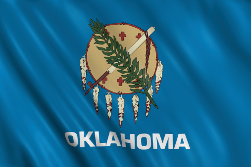 flag of oklahoma waving with highly detailed textile texture pattern
