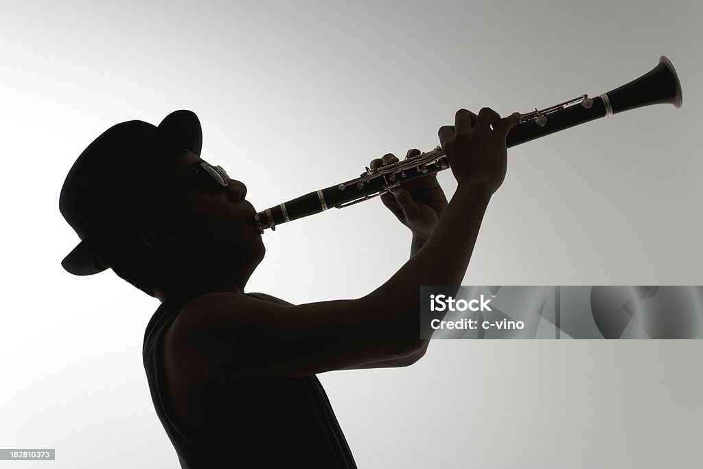 Silhouette di un Clarinettista - Foto stock royalty-free di Clarinetto