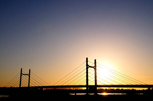 istock Sun over a Suspension bridge 182810460