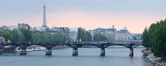 Panoramic view of the Eiffel tower and Pont des Arts (Paris, France).