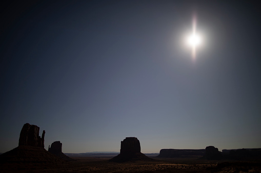 ring eclipse at the 14.10.2023, taken without any filter, Monument Valley, Utah, Arizona, USA, above West Mitten Butte, Merrick Butte and East Mitten Butte