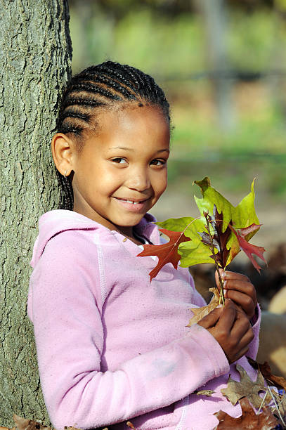 istock Girl with Autumn Leaves 182811170
