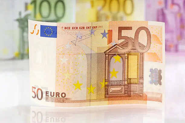 "Waved 50 Euro bill, 100, 200 and 500 EURO-note in the background.. (XXL-File)"