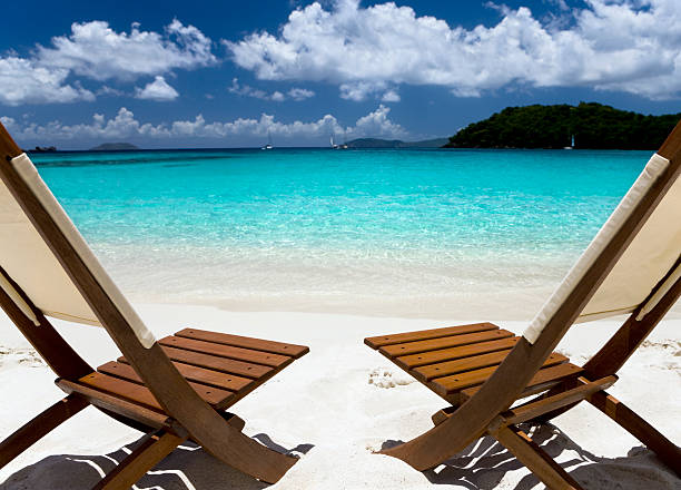 istock wooden chairs on a beach in the Caribbean 182811582