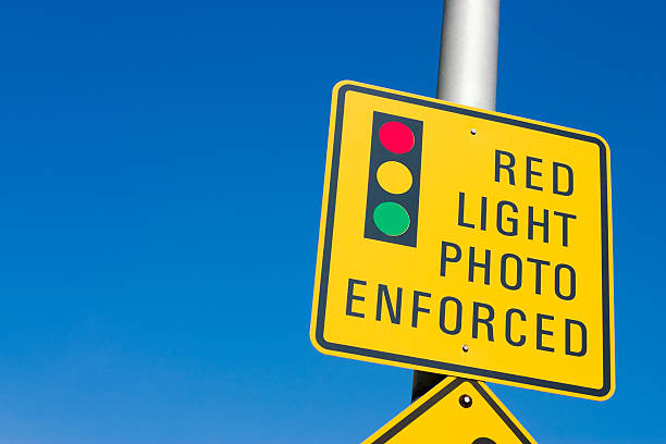 Red light photo enforcement sign stock photo