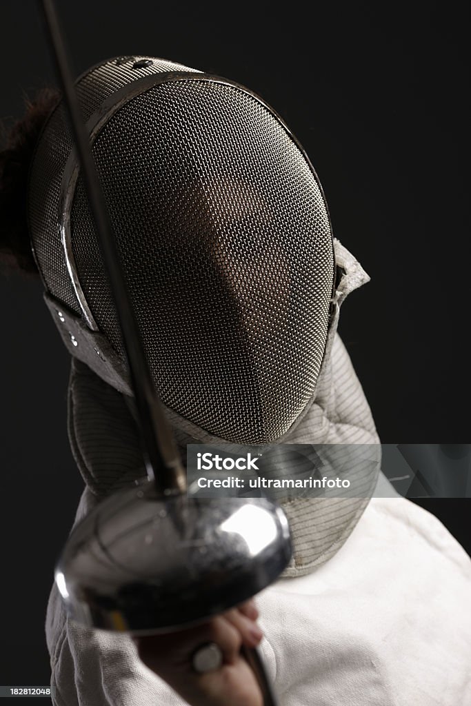Fencer Girl in fencing gear. Very shallow DOF . THIS IMAGE IS ONLY AVAILABLE HERE AT ISTOCKPHOTOSEE ALSO: Adult Stock Photo
