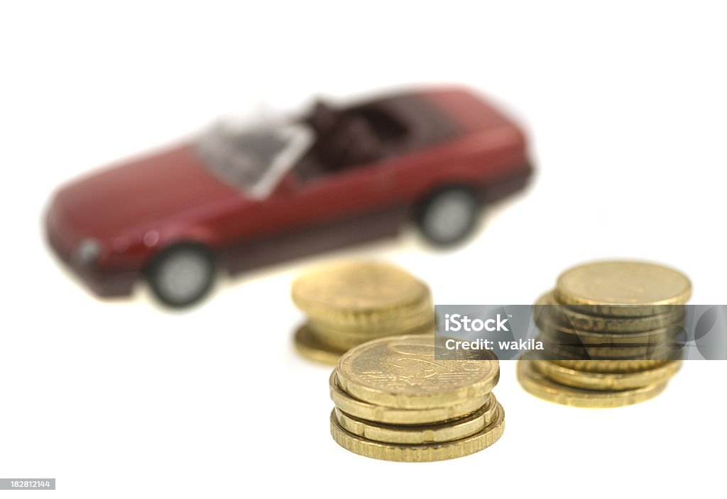 Buy a new car with coins macro abstract, unusual picture money in front of car. Studio-shot isolated on white Abstract Stock Photo