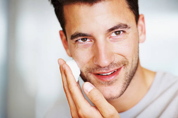 istock Happy handsome man applying shaving cream 182812198