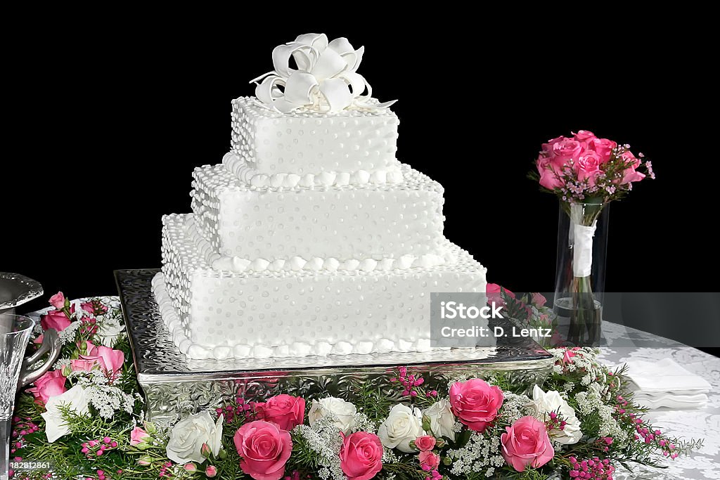 Wedding Cake A wedding cake isolated on a black background. Cut Out Stock Photo
