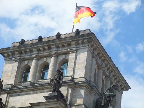 german government building in berlin with flag