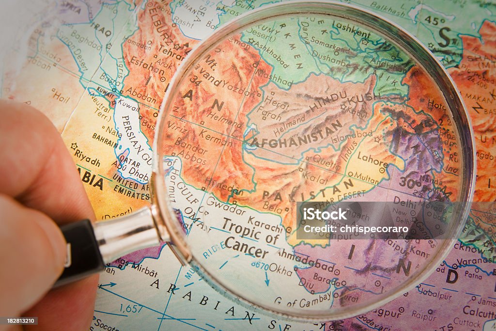 Travel the Globe Series - Afghanistan, Pakistan "Studying Geography - Photograph of Afghanistan, Pakistan and surrounding countries  on retro globe underneath a magnifying glass." Pakistan Stock Photo