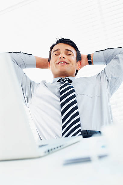 istock Handsome businessman relaxing in office 182813336