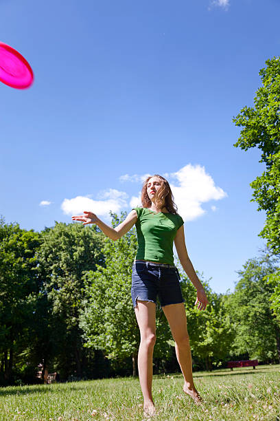 istock Throwing Frisbee in the Park 182813425