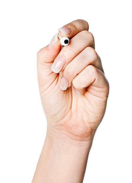 istock Close up of woman's hand pointing uncapped pen at camera 182813642