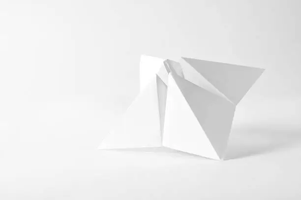 Horizontal image of a white paper fortune teller on a white background. The paper is blank so that text can be added if needed. 