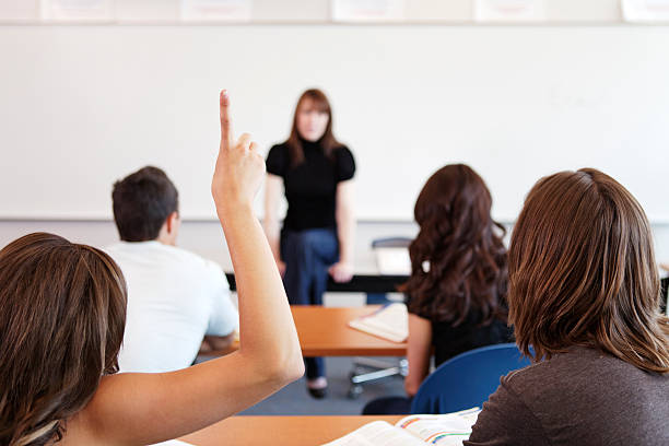 istock Female student raising her finger, selective focus 182814338