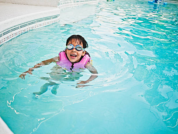 istock little girl swimming 182814361