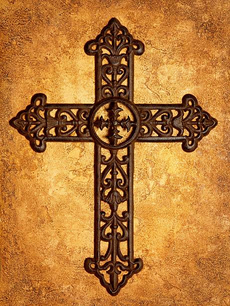 Religious: Iron Cross on Antiqued Textured Background Rust colored iron cross  on heavily textured gold and brown antiqued background.  Vertical image would be good for Christian or religious use. iron cross stock pictures, royalty-free photos & images