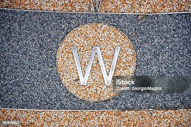 Letter W For West On Granular Exterior Floor Stock Photo - Download Image Now - Alphabet, Bumpy, Capital Letter