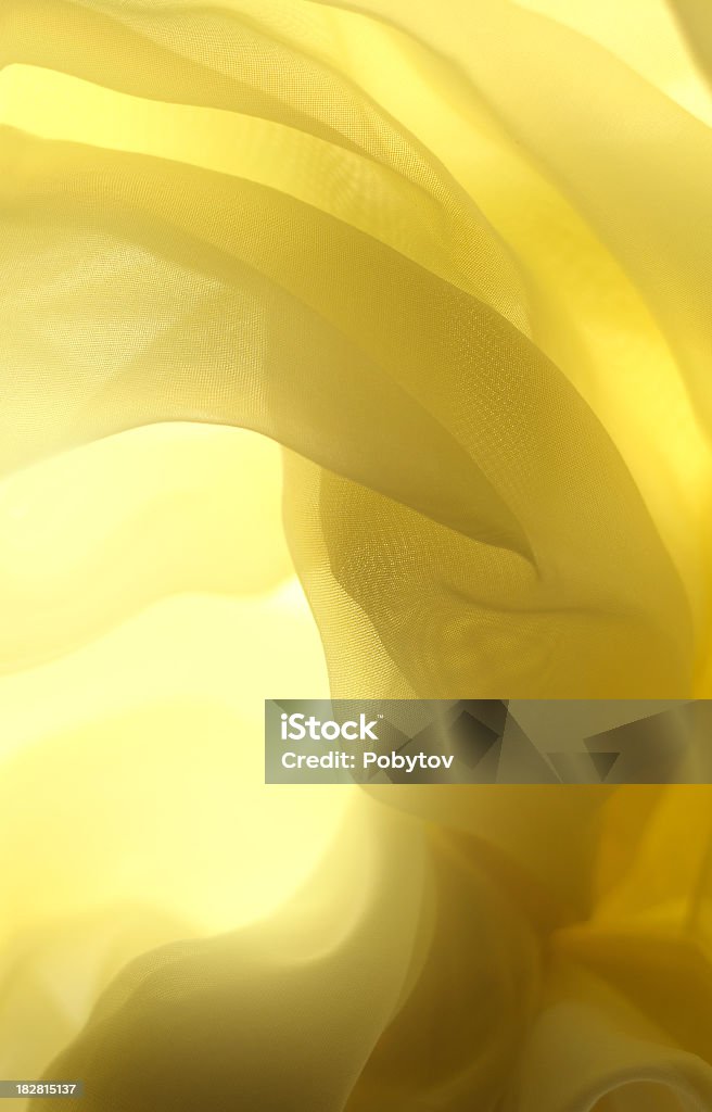 Yellow swirl-abstract background abstract background, Effortless fabric close-up in sun light Abstract Stock Photo