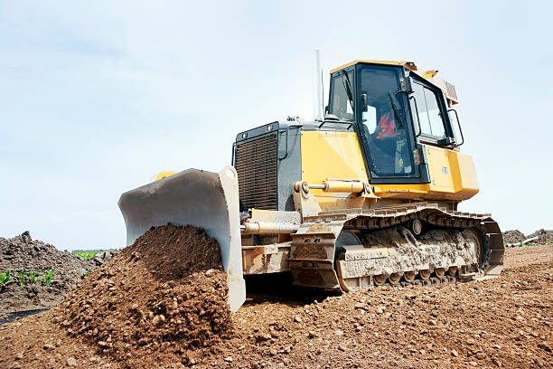 istock Bulldozer or earthmover machine working on road construction 182815178