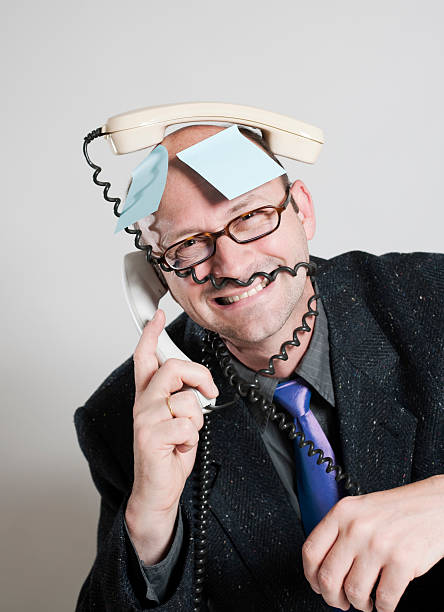 istock Businessman with receiver on his head 182815294