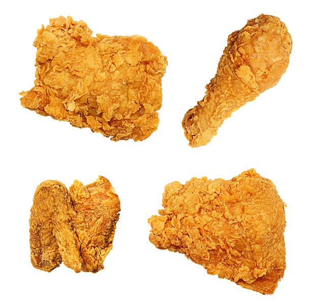 Fried Chicken Isolated Collection Assortment Winner, winner, chicken dinner! High-resolution digital capture of four precision-isolated pieces of extra crispy fried chicken set on a pure white background. One leg, one wing, one thigh and one breast. fritter photos stock pictures, royalty-free photos & images
