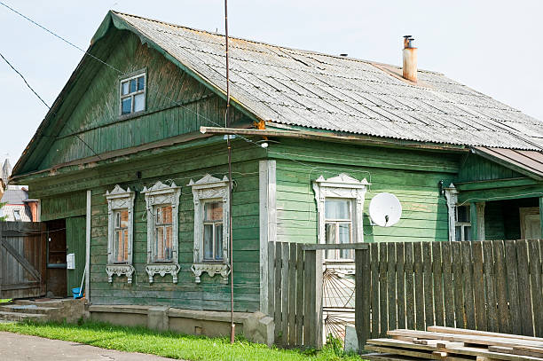 istock Old-fashioned wooden house with satellite dish - Russia 182816294