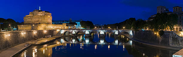 istock Rome Castel Ponte Sant'Angelo illuminated summer dusk Tiber panorama Italy 182816543